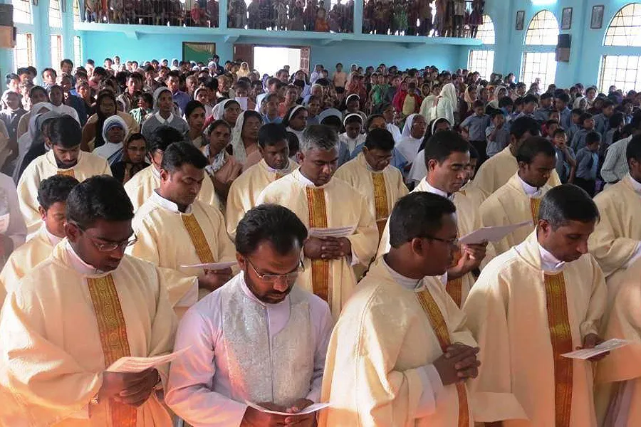 Priests concelebrate at the Miao diocese Chrism Mass on March 27, 2015. ?w=200&h=150