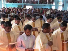 Priests concelebrate at the Miao diocese Chrism Mass on March 27, 2015. 