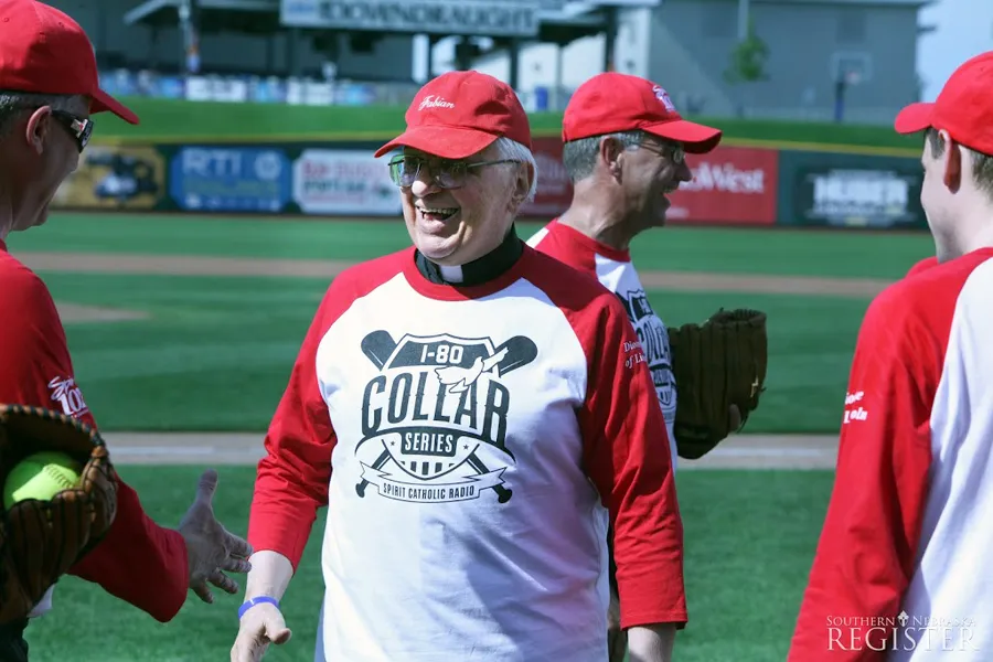 Bishop Fabian Bruskewitz, bishop emeritus of Lincoln, greets fellow priests and teammates at Werner Park in Papillion, Neb., before the I-80 Collar Series, June 21, 2015. ?w=200&h=150