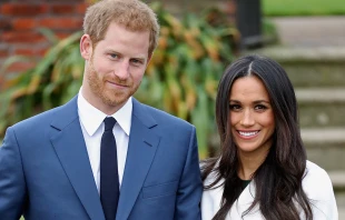 Prince Harry and Meghan Markle during an official photocall to announce their engagement at The Sunken Gardens at Kensington Palace in London, Nov. 27, 2017.   Chris Jackson/Getty Images.