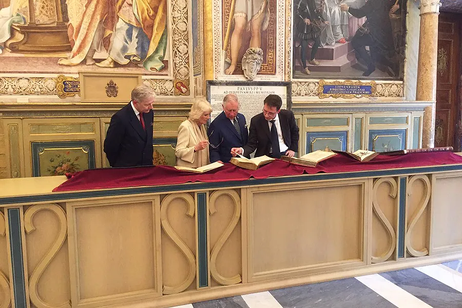 Charles, Prince of Wales, and Camilla, Duchess of Cornwall, examine books at the Vatican Library, April 4, 2017. Photo courtesy of Clarence House.?w=200&h=150