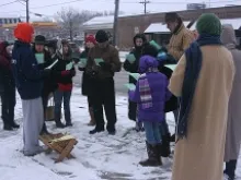 Pro-life supporters sing carols outside an abortion clinic, December 2011. 