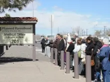 Pro-life advocates pray with a statue of Our Lady of Fatima in front of the Planned Parenthood Surgical Center in Albuquerque, March 20, 2013. 