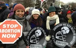 Pro-life marchers hold anti-abortion signs at the March for Life, Jan. 25, 2013. ?w=200&h=150