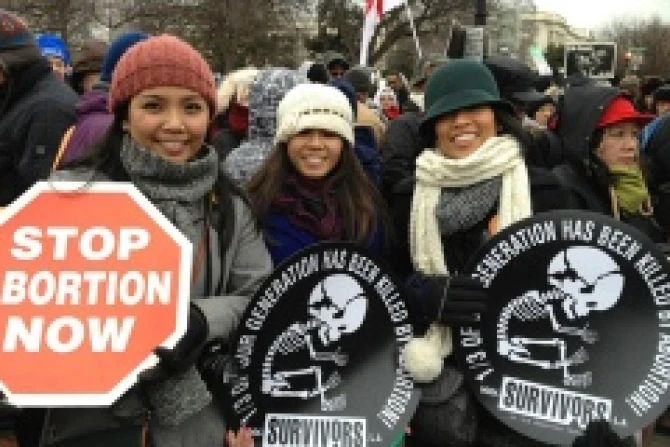 Pro life marchers hold anti abortion signs at the March for Life Jan 25 2013 Credit Addie Mena CNA CNA US Catholic News 1 25 13