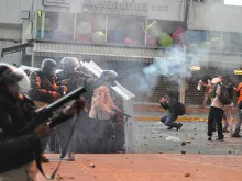   Protesters are met by riot police on Feb. 15, 2014 in Altamira, Caracas, Venezuela. 