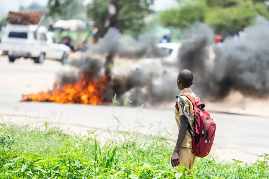 Protesters in Zimbabwe barricaded roads with burning tires after the government more than doubled the price of fuel January 2019. ?w=200&h=150