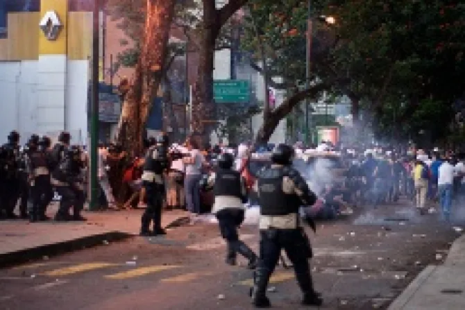 Protesters run from riot police on Feb 15 2014 in Altamira Caracas Venezuela  Credit andresAzp via Flickr CC BY NC ND 20 CNA 2 21 14