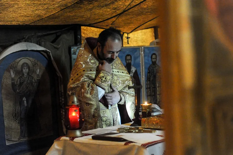 A Ukrainian Catholic priest at prayer during protests in Kyiv's Maidan Square, February 2014. ?w=200&h=150