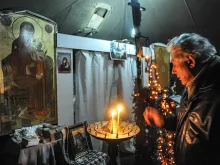 Protestors take refuge and pray for peace in one of two tent-chapels on Maidan Square in Kiev. 