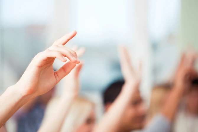 Raising hands participation Credit LStockStudio Shutterstock CNA