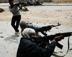Rebels fire at government troops during street fighting in Libya. ?w=200&h=150