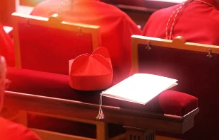 Red cardinal's biretta.   Elise Harris. CNA.