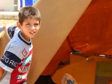 Refugee child in Ankaway, Erbil at the opening of his tent_Catholic News Agency. 