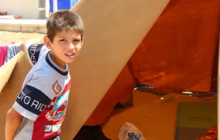 Refugee child in Ankaway, Erbil at the opening of his tent_Catholic News Agency.   Maria Lozano.