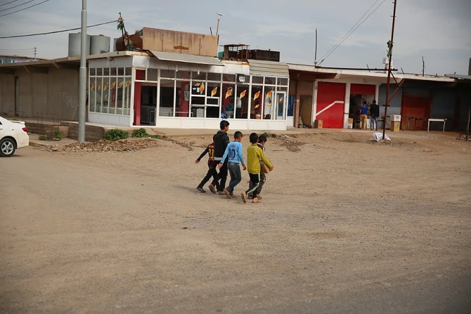 Refugee children walking in the city of Duhok Iraq on March 28 2015 Credit Daniel Ibanez CNA 4 1 15