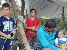 An internally displaced Iraqi Christian family take shelter at the Syriac Catholic Mrtshmony Shrine in Erbil. 