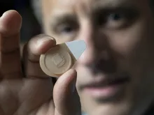 Regents Professor Mark Prausnitz holds an experimental microneedle contraceptive skin patch. 