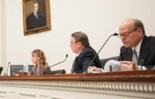 Rep Chris Smith (Center) listens during an Helsinki Commission hearing on sex trafficking and abuse of children, October 4, 2012. 