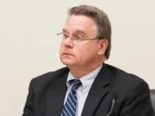 Rep Chris Smith listens during an October 4 Helsinki Commission hearing. 