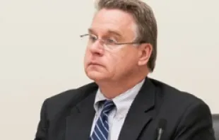 Rep Chris Smith listens during an October 4 Helsinki Commission hearing.  