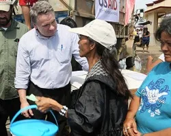 Rep. Smith joins a clean water distribution line operated by Catholic Relief Services and USAID to talk with victims of the typhoon. ?w=200&h=150