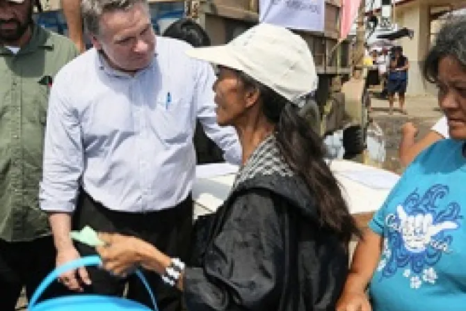 Rep Smith joins a clean water distribution line operated by Catholic Relief Services and USAID to talk with victims of the typhoon Credit Jim Stipe Catholic Relief Services CNA