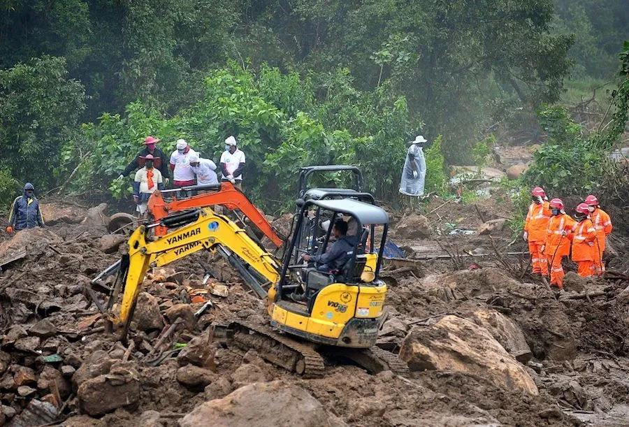 Rescue workers search for missing people at a landslide site in Kerala state Aug. 10, 2020. ?w=200&h=150