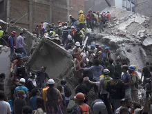 Rescuers work in the rubble after a magnitude 7.1 earthquake struck on Sept. 19, 2017 in Mexico City, Mexico. 