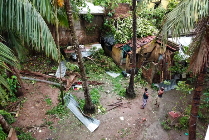 Residents survey damage left by Cyclone Amphan in Gobardanga West Bengal India May 21 2020 Credit Boby Ortain Shutterstock