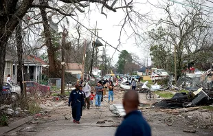 Residents walk down a street along Chef Menture Ave after a tornado touched down in the eastern part of the city on Feb. 7, 2017 in New Orleans.   Sean Gardner, Getty Images.