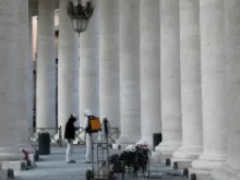 Workers at the Vatican restore part of the Bernini colonnade in early 2014. 