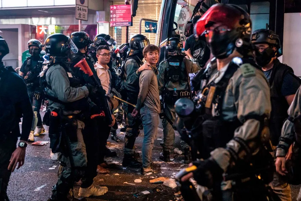 Riot police detain two men after clearing protesters from the Central district in Hong Kong, Nov. 13, 2019. ?w=200&h=150