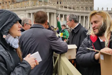 Romes homeless join volunteers in handing out copies of the Gospel to pilgrims in St Peters Square March 22 2015 Credit Martha Calderon CNA 3 22 15