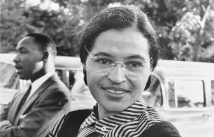 Rosa Parks, with Martin Luther King, Jr. in the background, c. 1955.   US Information Agency/Public Domain.