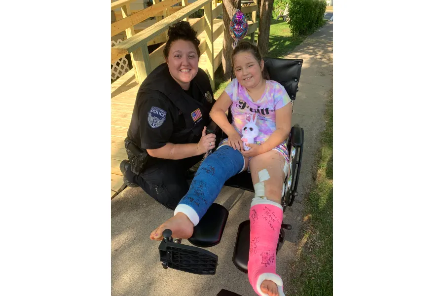 Rosie Sajevic (R) recovering from her accident with a local police officer. Photo courtesy of Teresa Sajevic.?w=200&h=150