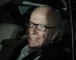 Rupert Murdoch smiles at photographers as he is driven from News International's headquarters on July 13, 2011 in London, England. Photo by Peter Macdiarmid / Getty Images News / Getty Images?w=200&h=150