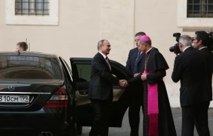 Archbishop Georg Gaenswein, prefect of the papal household, greets Russian president Vladimir Putin upon his arrival at the Vatican, June 10, 2015.   Bohumil Petrik/CNA.