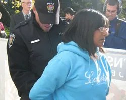 Ruth Lobo is handcuffed by the Ottawa police. ?w=200&h=150