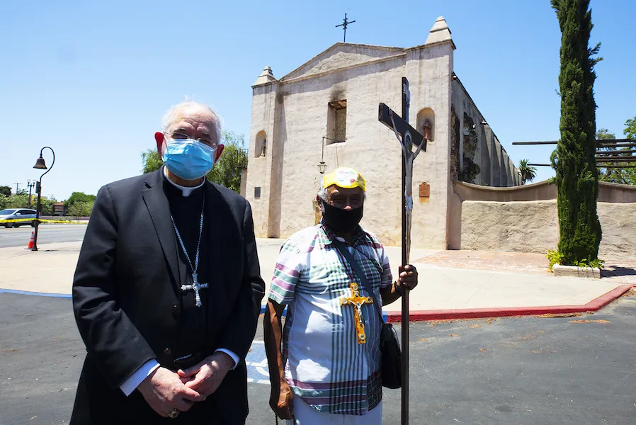 Archbishop Jose Gomez and a local pilgrim outside the San Gabriel Mission July 12. ?w=200&h=150