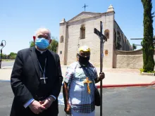 Archbishop Jose Gomez and a local pilgrim outside the San Gabriel Mission July 12. 