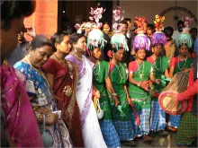 Santal people dance during a marriage ceremony. 