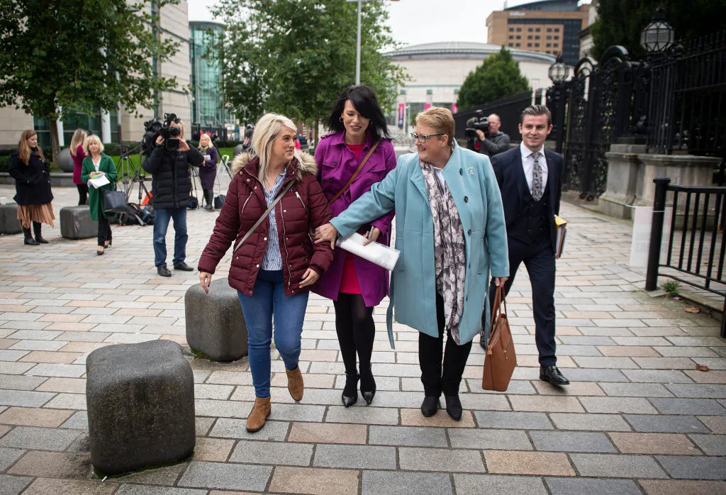 Sarah Ewart (L), Jane Christie (R), and Grainne Teggart (C) leave Belfast High Court after the ruling in their favour, Oct. 3, 2019. ?w=200&h=150