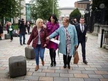 Sarah Ewart (L), Jane Christie (R), and Grainne Teggart (C) leave Belfast High Court after the ruling in their favour, Oct. 3, 2019. 