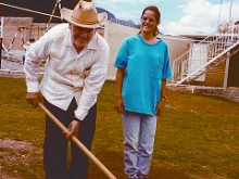 In this 1996 photo the late Father Patrick Quinn and a young person from the Diocese of Jackson, Miss. (Mississippi Catholic file photo)