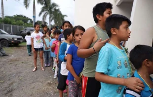 Children queue outside a shelter in Guatemala in 2018.   Ivan Palma/Catholic Relief Services.