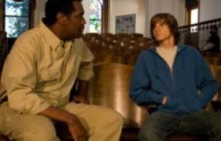 School custodian Leonard, played by Charles Graham, speaks to Christian Revere, played by Hunter Gomez, on the set of Last Ounce of Courage.