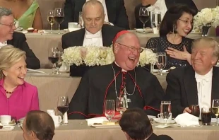 Screenshot from 2016 Al Smith Dinner, with Hillary Clinton, Cardinal Timothy Dolan, and Donald Trump. Screenshot NY Times YouTube video.