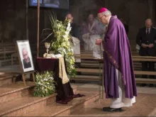 Bishop Rudolf Voderholzer stands before a portrait of Msgr. Georg Ratzinger at Regensburg Cathedral July 8, 2020. 