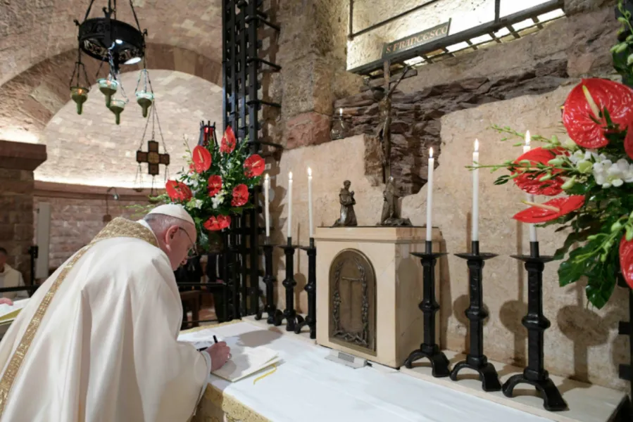 Pope Francis signs the encyclical Fratelli tutti at the tomb of St. Francis of Assisi Oct. 3, 2020. Credit: Vatican Media.?w=200&h=150